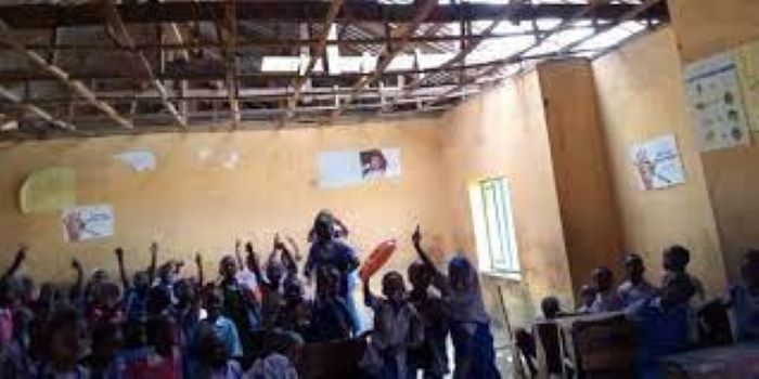 Children learn under rain, sun in Nigeria's capital