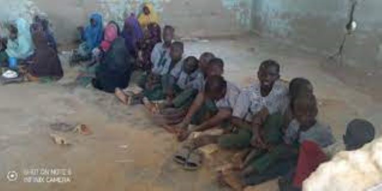 Despicable Kebbi School Kids sit on bare floor