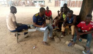 Dobi community farmers discussing climate change with MAWA officials