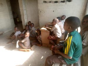 Children in a deplorable classroom